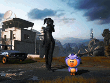 a woman in a black suit stands next to a small purple toy