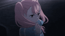 a girl with pink hair is holding her hair