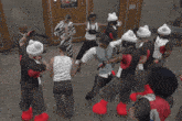 a group of people are dancing in a room with a sign that says supreme on it