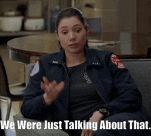 a woman sitting in a chair with the words we were just talking about that on the bottom