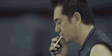 古惑仔 GIF - Gangster Smoking Wink GIFs
