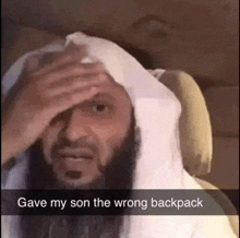 a man with a beard holds his hand to his forehead with the words gave my son the wrong backpack above him