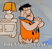 flintstone from the flintstones is praying in front of a lamp and a table .