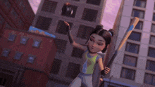 a black ball is flying through the air in front of a building .