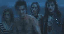 a group of people standing next to each other with one wearing a california club shirt