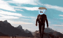 a man with a blue face and a hat is walking in front of a mountain