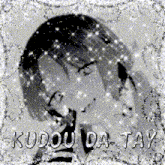 a black and white photo of a girl with the words kudou da tay written on the bottom
