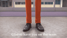 a man in orange pants and black shoes with the words glad to have you on the team