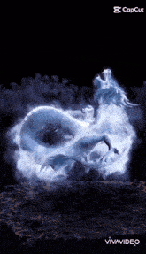 a dragon is surrounded by a cloud of smoke and is being created by vivavideo