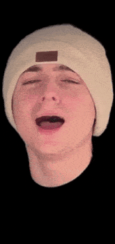 a young man wearing a white beanie and a black shirt with jay 16 written on it
