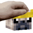 a hand is holding a minecraft block with a yellow ribbon around it .