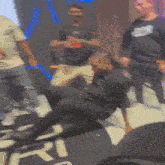 a man is laying on the floor in front of a sign that says ' ri '