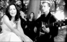 The Corrs Sing GIF - The Corrs Sing Playing Guitar GIFs