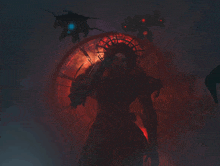 a silhouette of a person holding a gun in front of a red clock