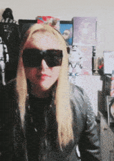 a woman wearing sunglasses stands in front of a darth vader