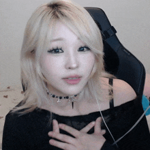 a woman wearing a choker and headphones is sitting in a chair that says relax on it