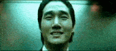 a close up of a man 's face with his eyes closed and his mouth open .
