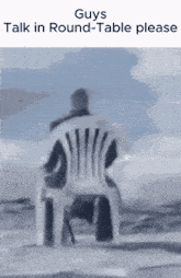 a man is sitting in a chair with the words " guys talk in round-table please " above him