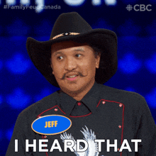 a man wearing a cowboy hat and a name tag that says jeff says i heard that