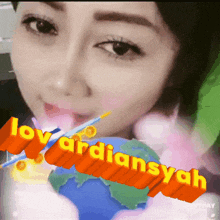 a close up of a woman 's face with the words " loy ardiansyah " on the bottom
