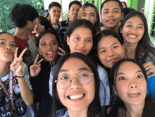 a group of young people posing for a picture with a lanyard that says high school on it
