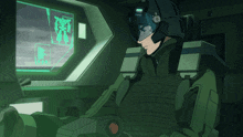 a man in a military uniform is sitting in front of a computer screen