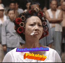a woman with curlers on her head has a cigarette in her mouth and the words " assalamualaikum pakalolo " below her