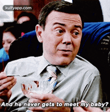 a man in a suit and tie is holding a bowl of food and says " and he never gets to meet my baby ? "