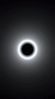a black circle with a white ring around it on a black background