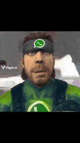 a man wearing a headband that has a whatsapp logo on it