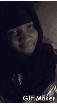 a person wearing a black hoodie with the word gif maker on it