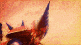 a close up of a person 's head with a red and blue feather on it