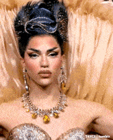 a close up of a woman wearing a necklace and earrings with t4yce tumblr in the corner