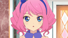 a girl with pink hair and blue eyes is wearing a blue collar