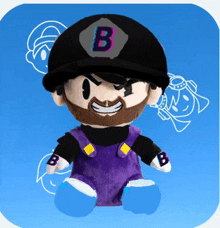 a stuffed toy with the letter b on the hat