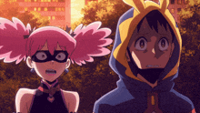 a boy and a girl are standing next to each other and the girl has pink pigtails