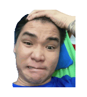 a man in a blue shirt is making a face with his hand on his head