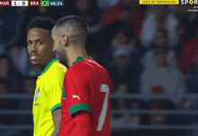 a soccer game is being played between brazil and portugal
