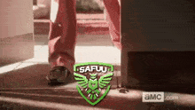 a pixel art of a person 's feet walking into a doorway with a logo for safuu .