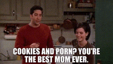 a man and a woman are standing in a kitchen with the words cookies and porn ? you 're the best mom ever ..