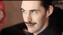 a man with a mustache has white eyes