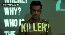 a man in a police uniform is standing in front of a projection screen that says `` why ? who is killer ? ''