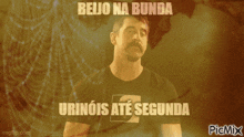 a man with a mustache is standing in front of a spider web with the words " beijo na bunda " above him