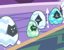 a cartoon drawing of four eggs with faces