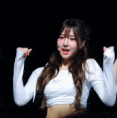 a woman in a white crop top that says blessed