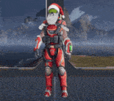 a man wearing a santa hat and gloves is standing on a platform