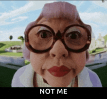 a woman wearing glasses and red lipstick says " not me "