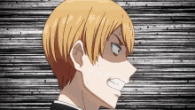a close up of a man 's face with a very angry look on his face