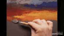 a person is painting a landscape with a spoon and the words made in animotica on the bottom