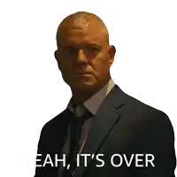 a man in a suit and tie has the words yeah it 's over on his face